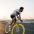 workout hairstyle: image of a man with short hair, riding a mountain bike