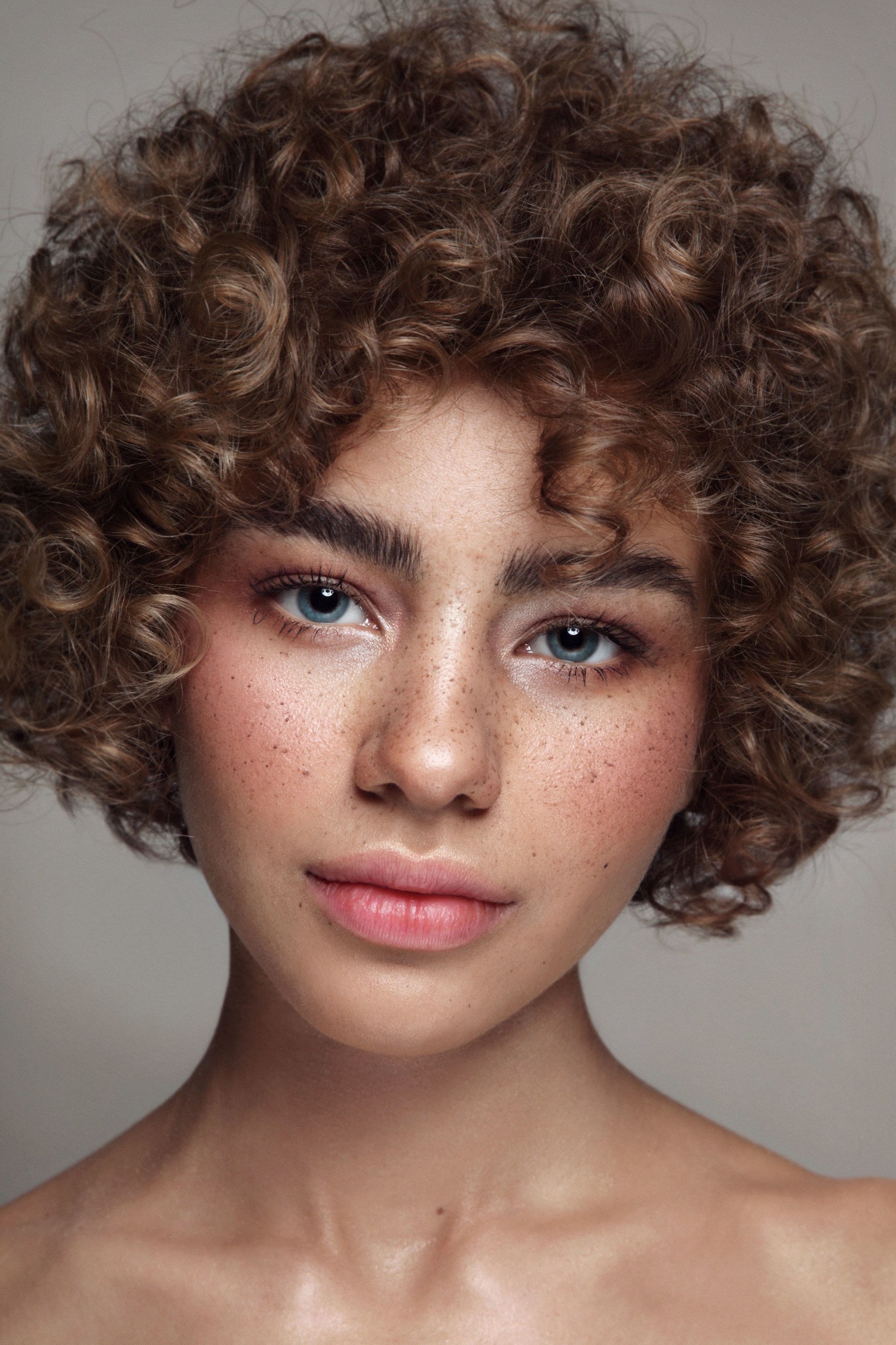 Woman with short tight curls