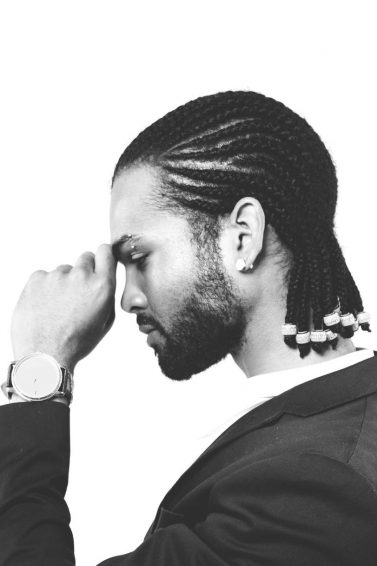 men's medium hairstyles: man with straight-back cornrows and beads at the end of each cornrow