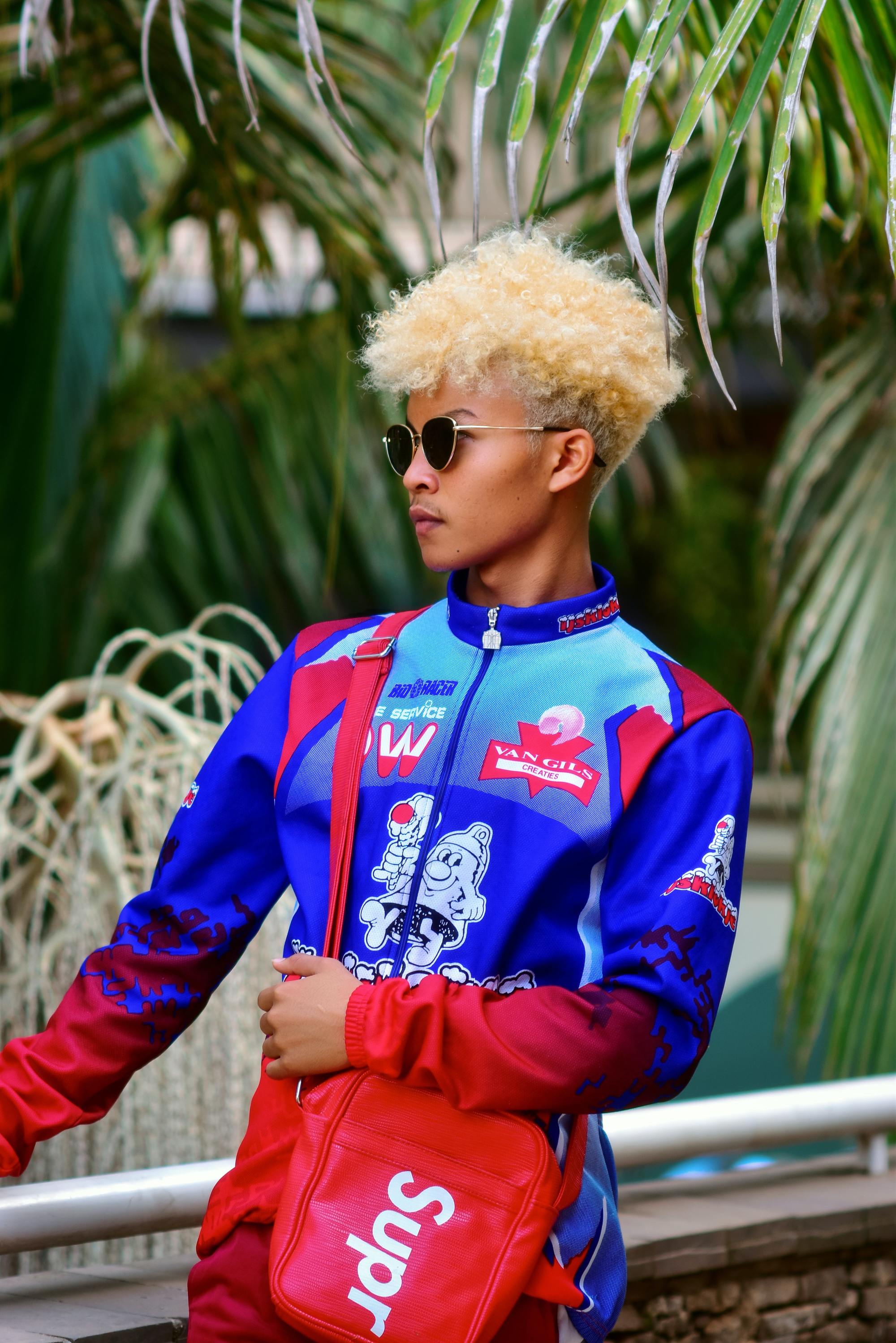 blonde curls: woman with short blonde curly hair and an undercut