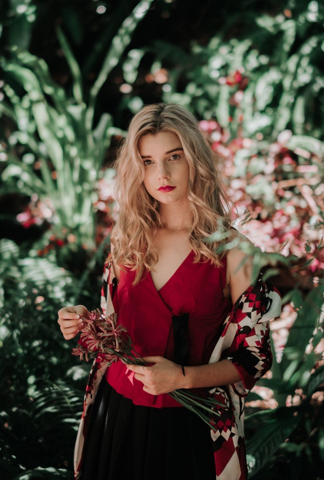 woman with medium length blonde hair with soft curls