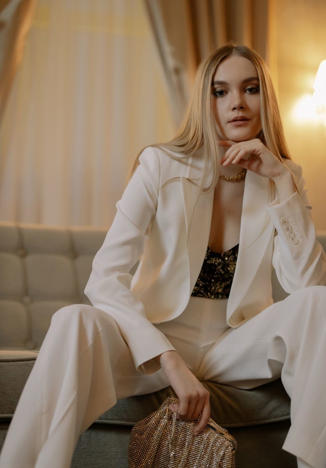 New York Fashion Week 2022: woman wearing a cream suit with long, blonde, straight, sleek hair