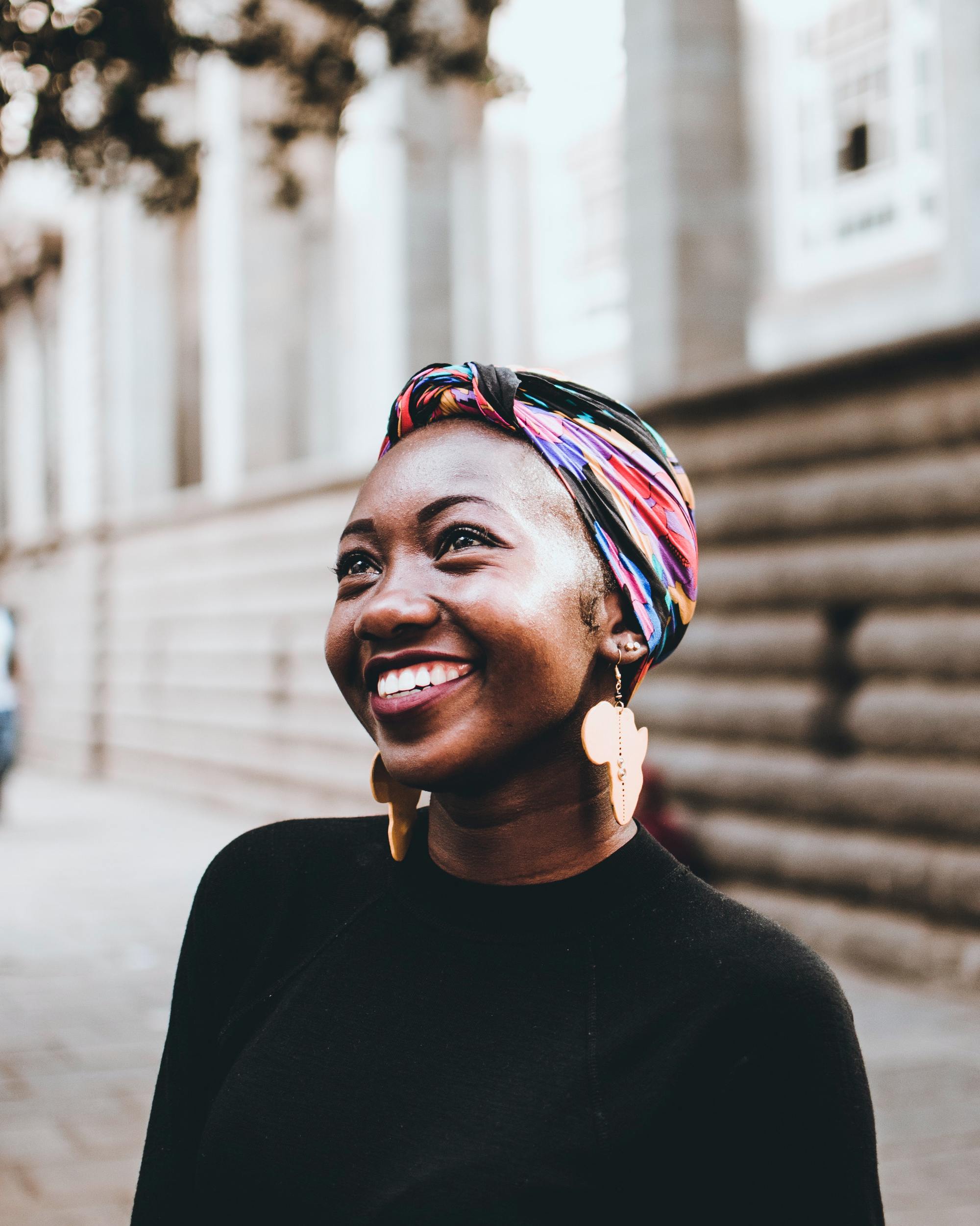hair accessories: woman wearing a colourful headwrap with a small knot in the front