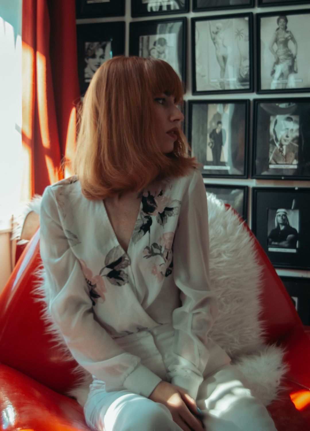 woman with ginger-coloured hair, with a lob haircut with curled ends