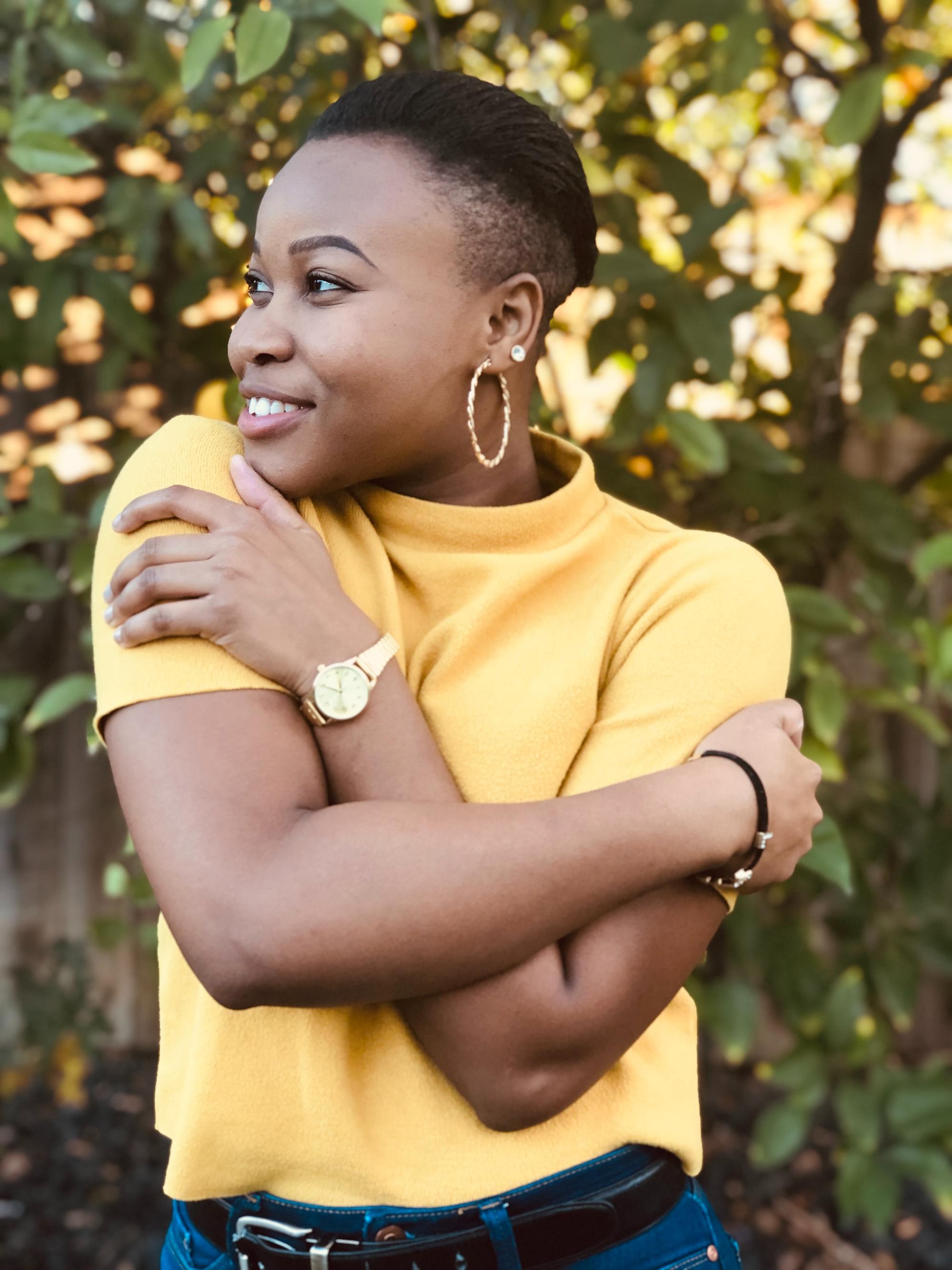 winter hairstyles: woman with natural hair cut short with an undercut
