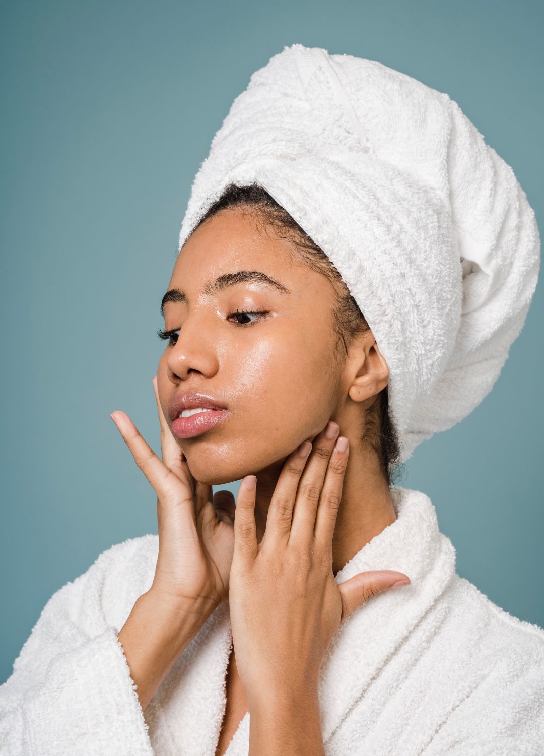 woman with her hair wrapped in a white towel
