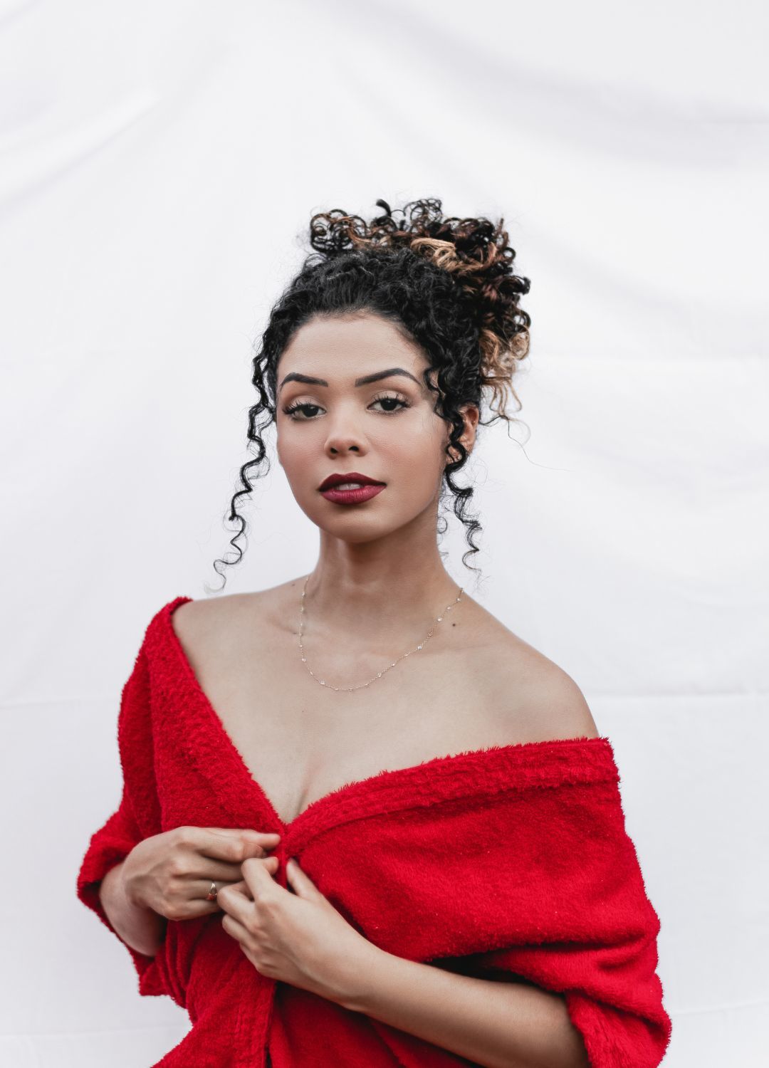 flawless hair: woman with naturally curly hair, tied up into a curly updo