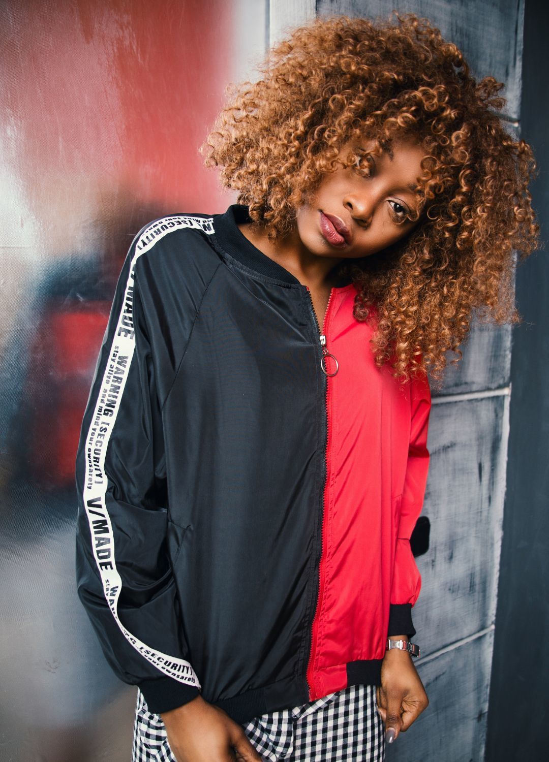 flawless hair: woman with shoulder length curly hair with a light brown ombre