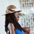 woman wearing a brown, broad-brimmed hat