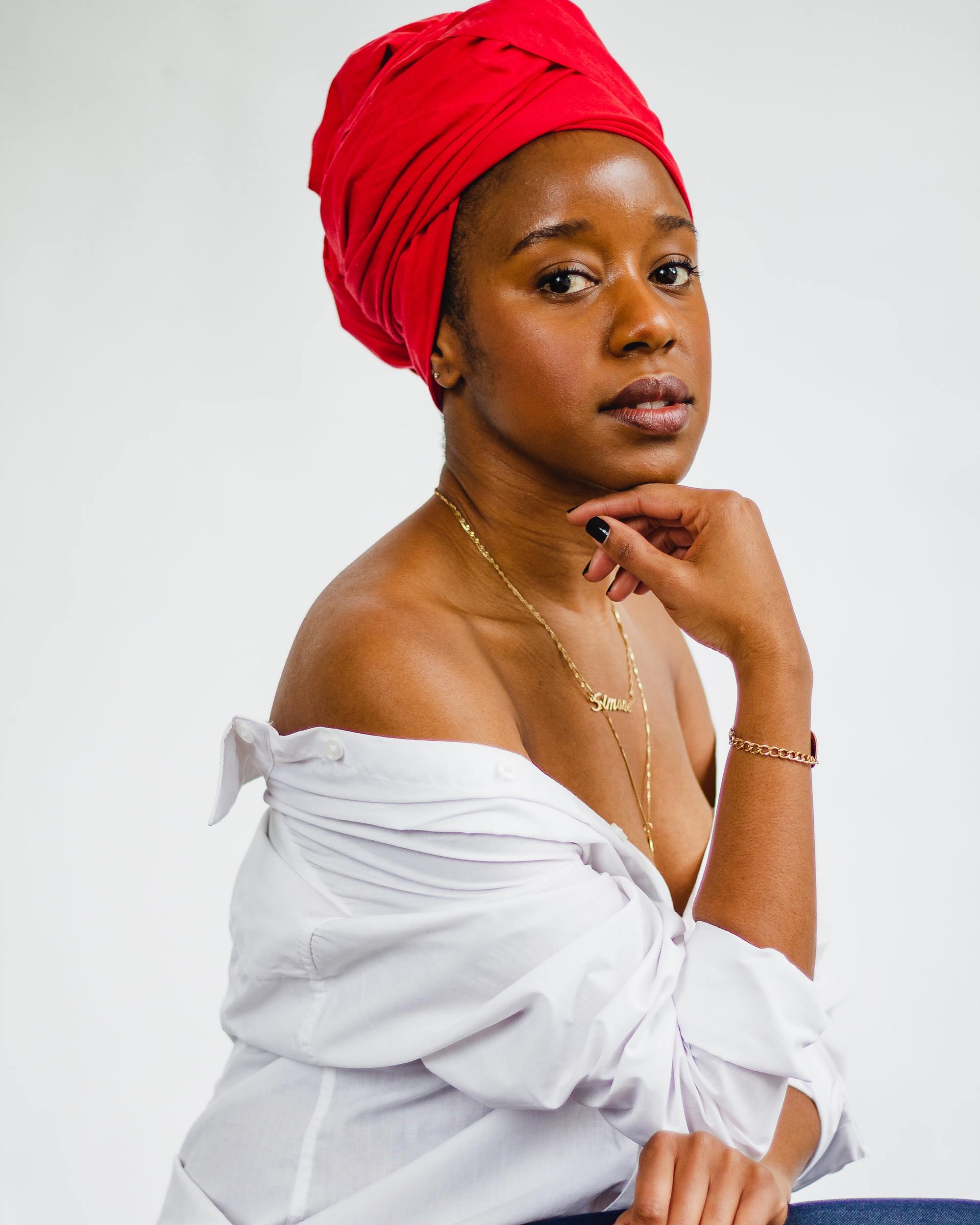woman wearing a bright red head wrap
