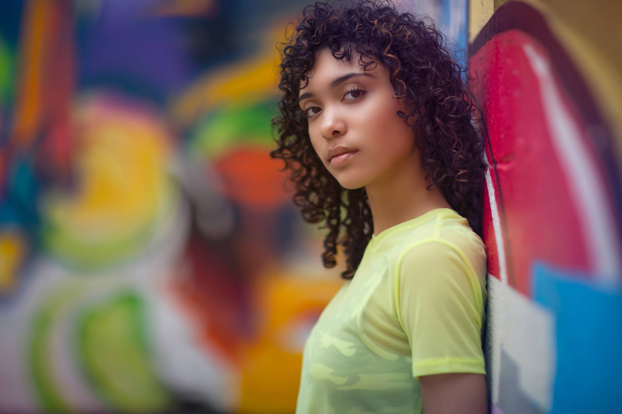 fine curly hair: girl with thin curly hair cut into layers