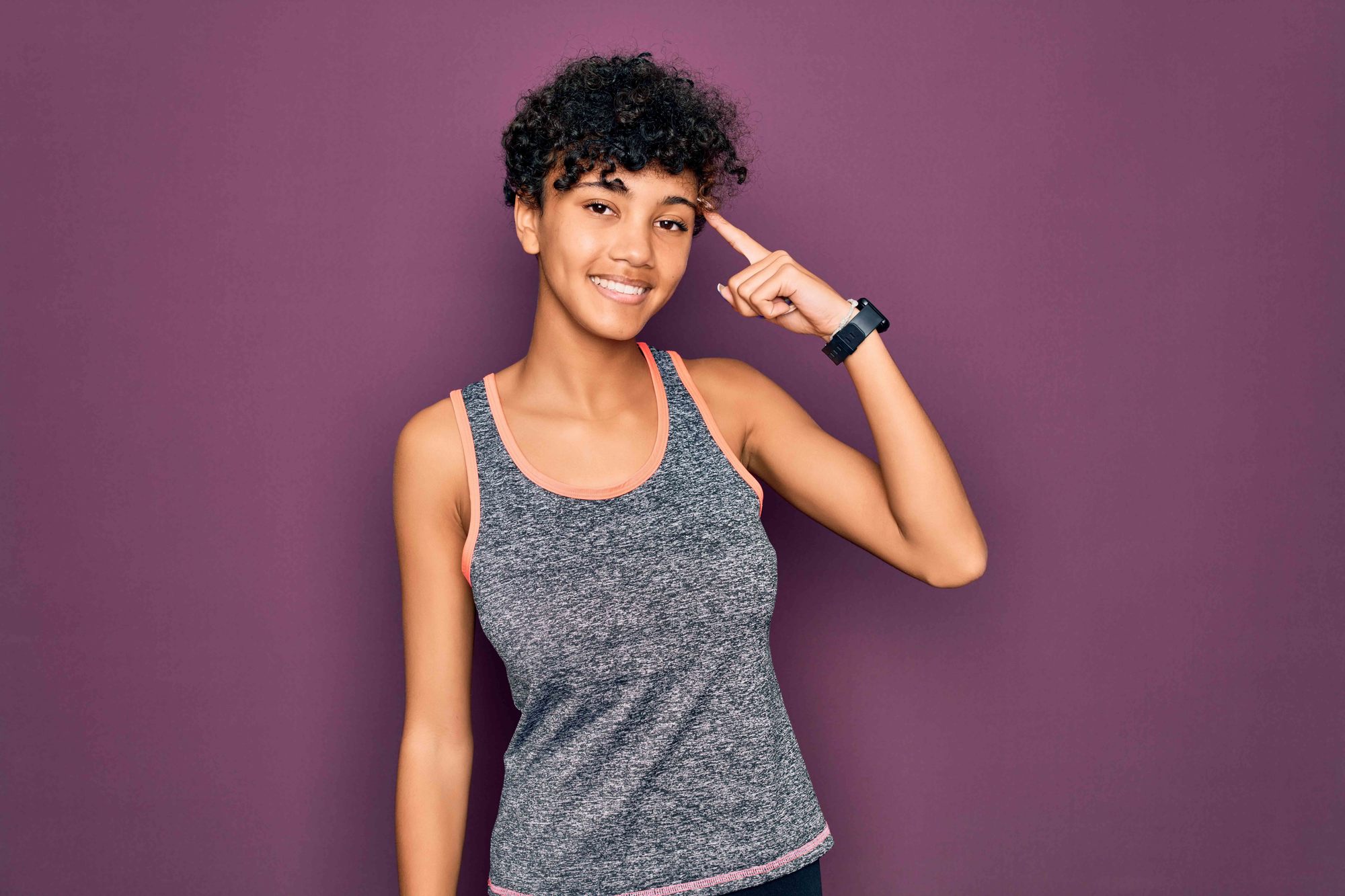 woman with a curly pixie cut