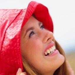 Woman wearing a red rain bonnet