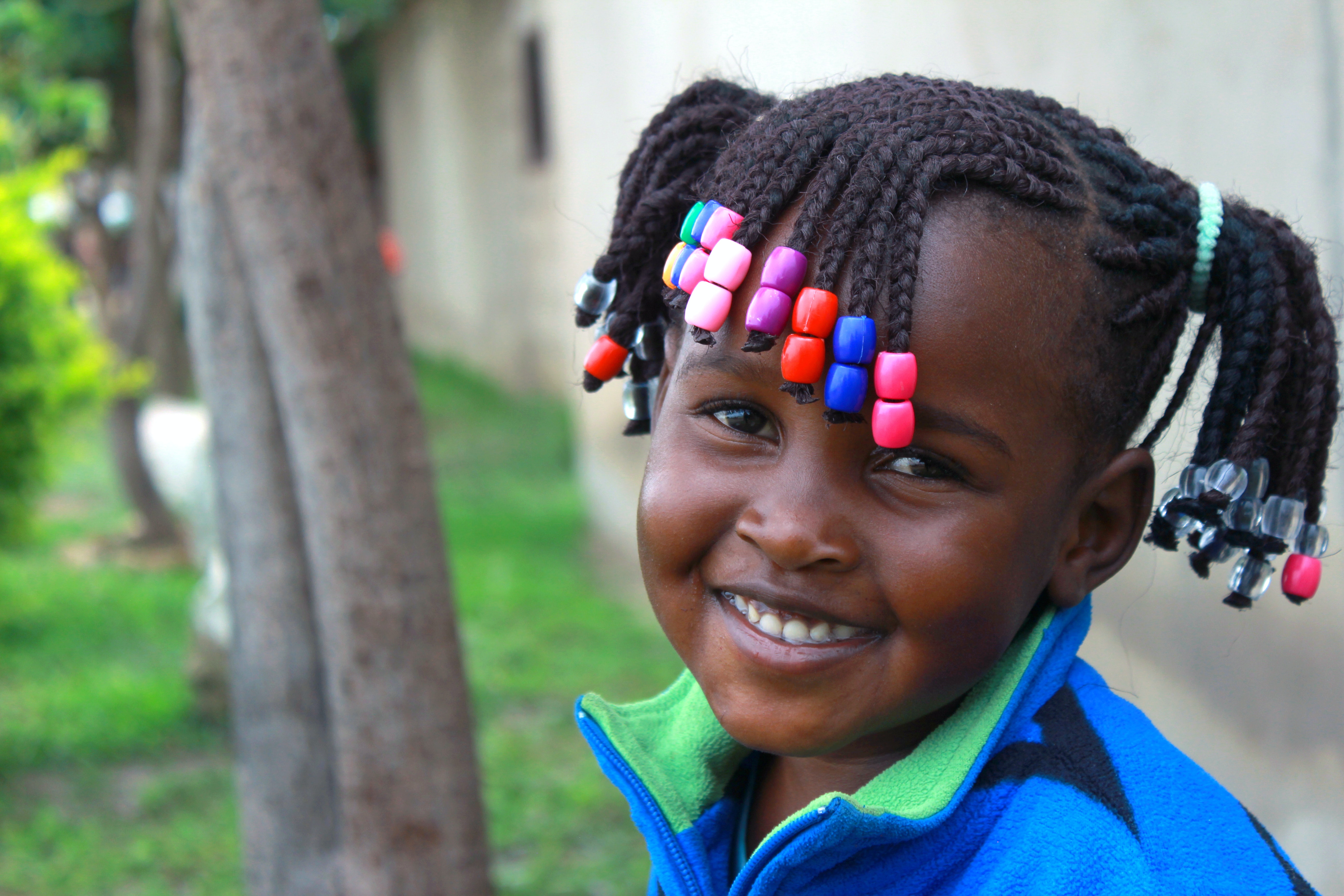 Little girl with braided beads hairstyle