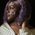 Woman with short mauve hair
