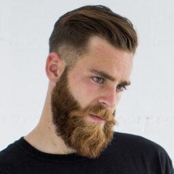 Corte fade bajo para hombre con barba