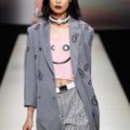 asian female fashion model walking on a runway