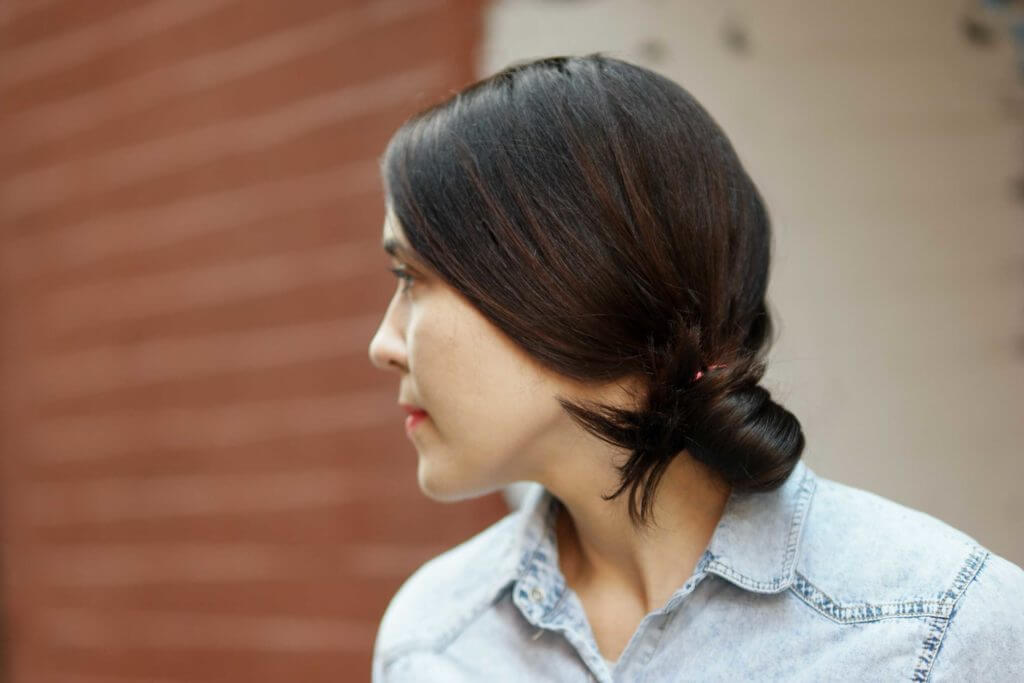 travel-friendly hairstyles low bun