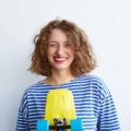 Brunette woman with curly hair bob no layers