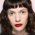 Brunette woman with curly hair bob