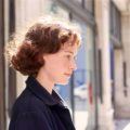 Brunette woman with curly hair bob