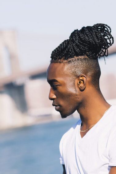 A photograph of an Indian male with beautiful long wavy hair reaching his  shoulders - Man Bun Hairstyle