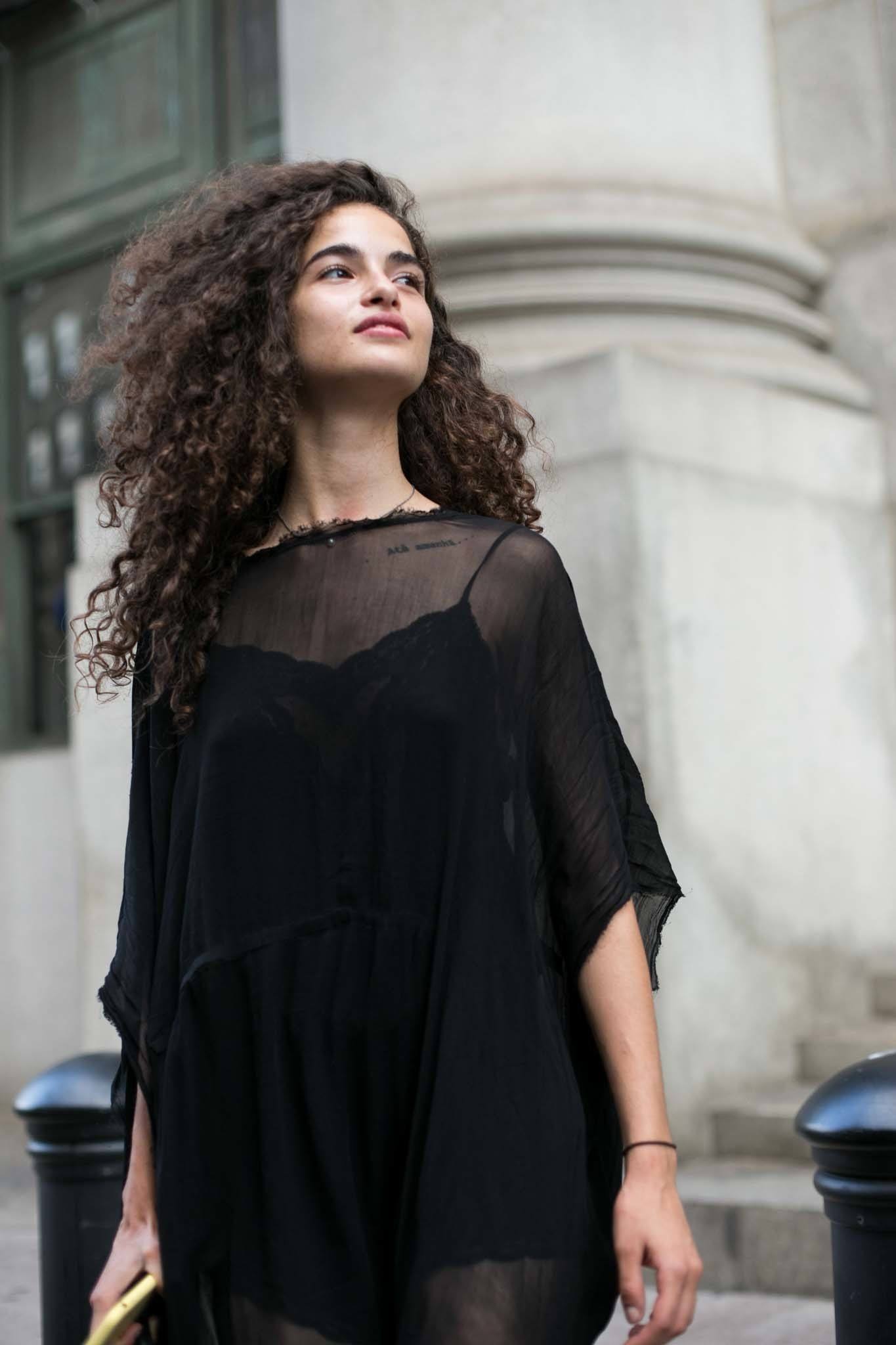 young woman with defined curls hairstyle on long hair