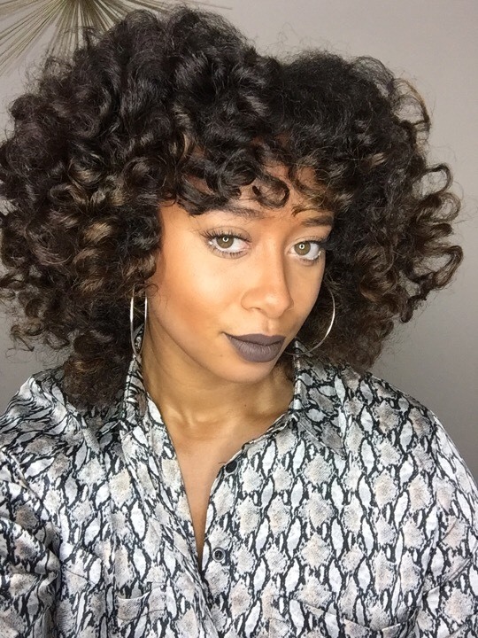 Jillyian Kelly wearing bouncy natural curls hairstyle