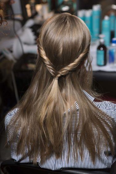 sleek hair trend for spring with hair twists
