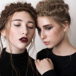 brunette and blonde women wear fishtail braided crowns for prom