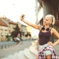 a casual style of a woman with side shaved hair taking a selfie