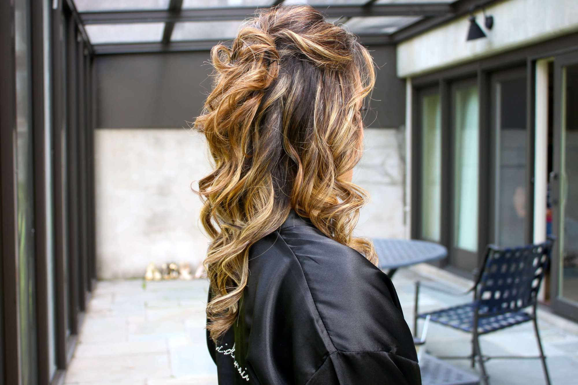 sandy blonde balayage curly hair