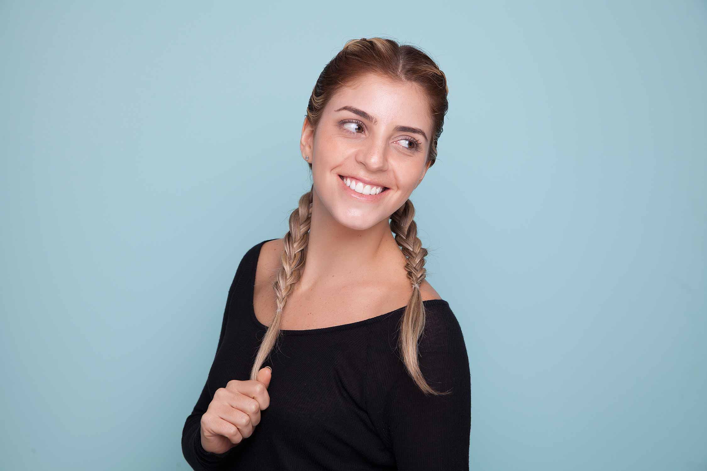 criss-crossed blonde hair with dark roots