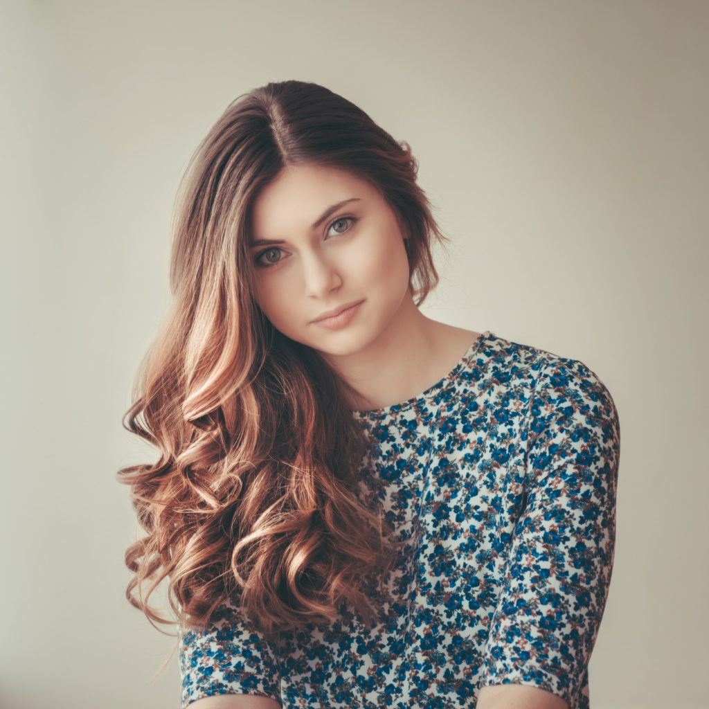 loose perm brunette highlights long