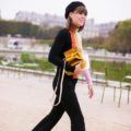 a stylish cute woman walking on a park