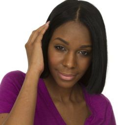 closeup shoot of a beautiful black woman touching her hair on white background