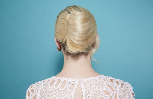 Blonde woman with a French twist updo