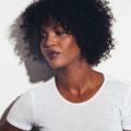 black hairstyles with bangs: curly fringe