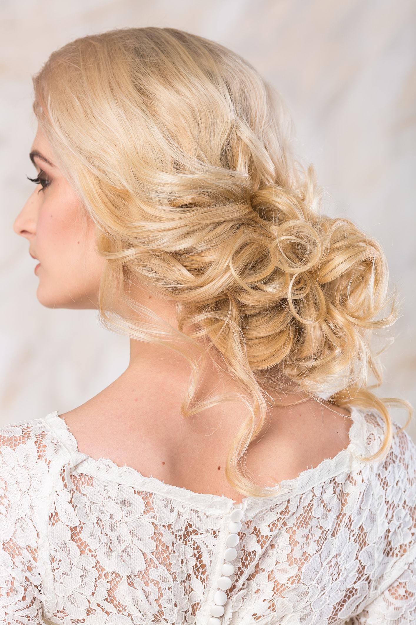 cosmetology hair loose low blonde updo