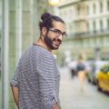 medium hairstyles for men with thick hair: man bun