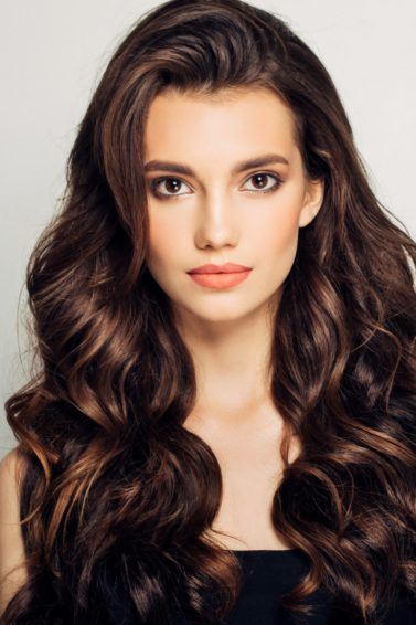 signature hairstyle long brown curls volume
