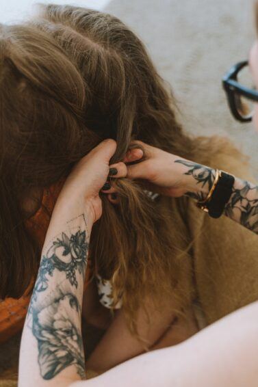 Girl with a hairstyle Greek braid in vintage style in profile on a gray  background close-up. Stock Photo | Adobe Stock