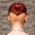 female undercut long hair red bun