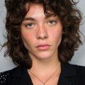 girl with 70s feathered shag
