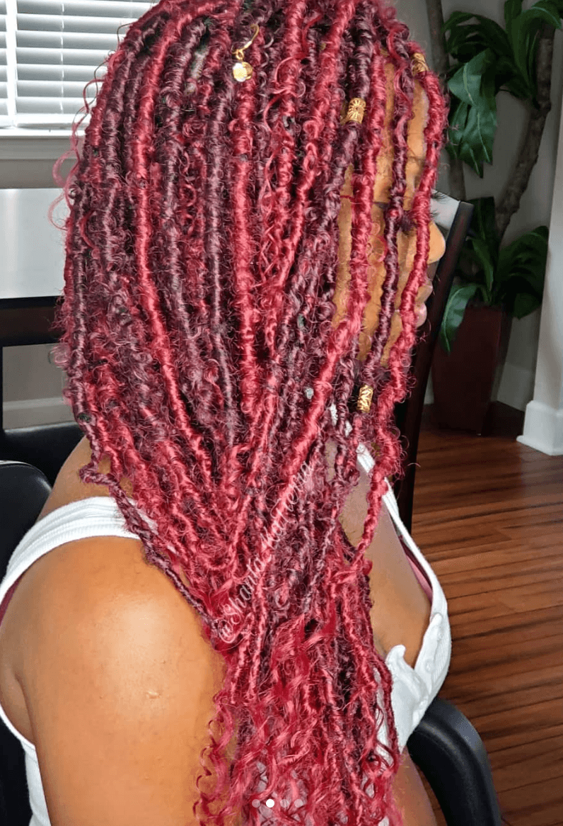 girl with red goddess locs