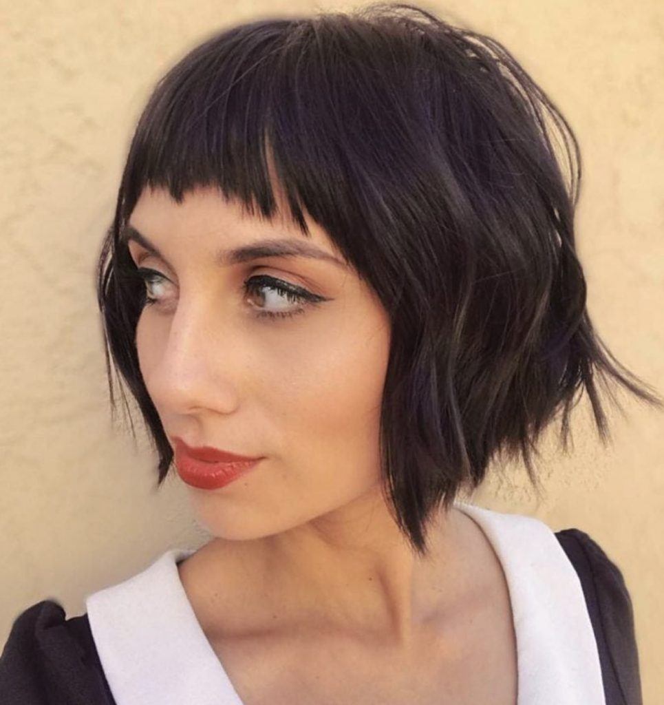 girl with black bob angled