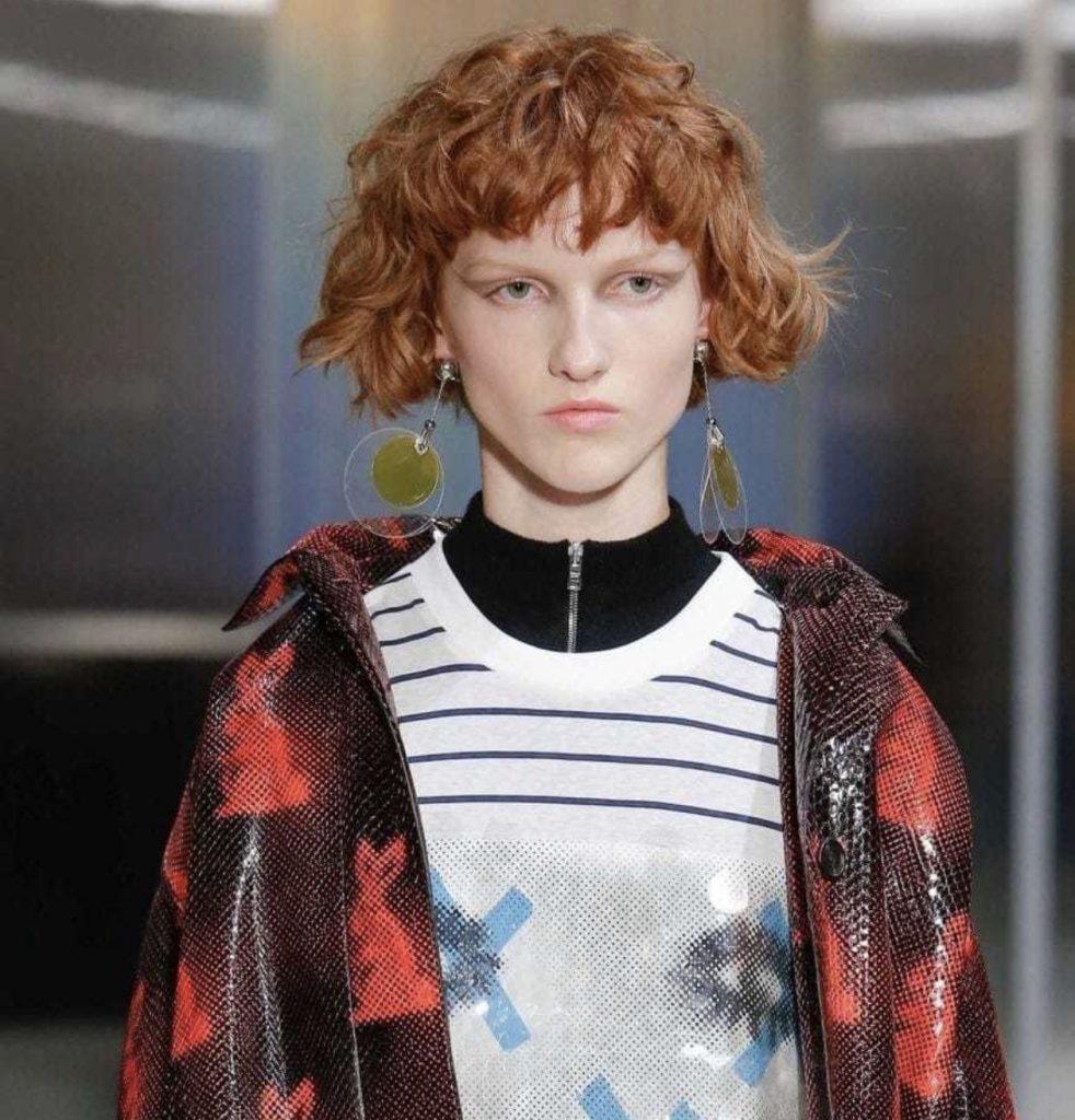 girl with wavy red bob