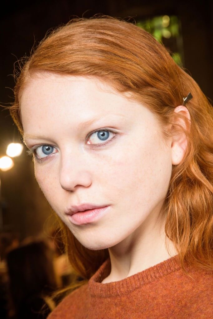 model with a bright ginger copper hair colour