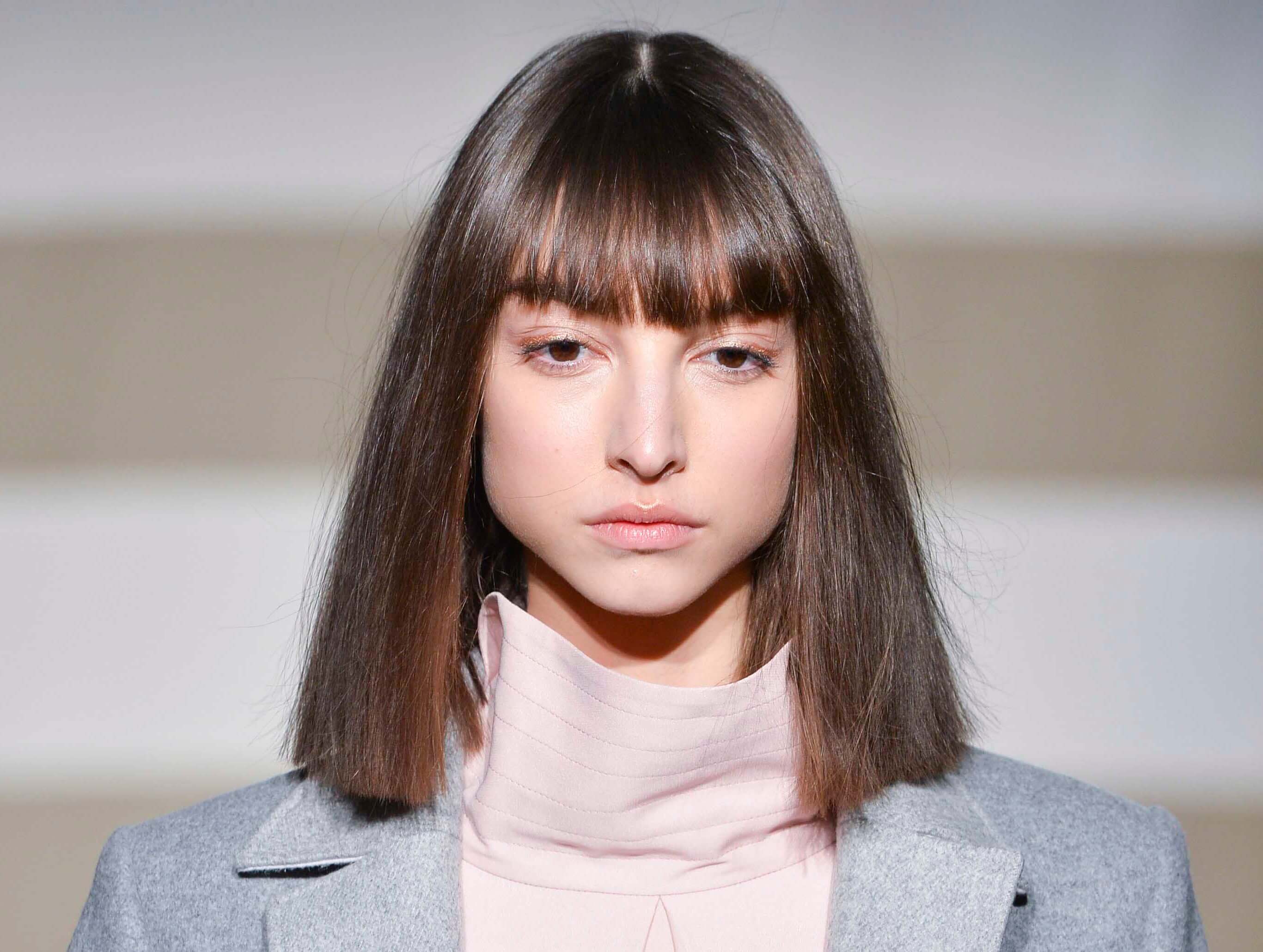 Brunette model with straight blunt long bob