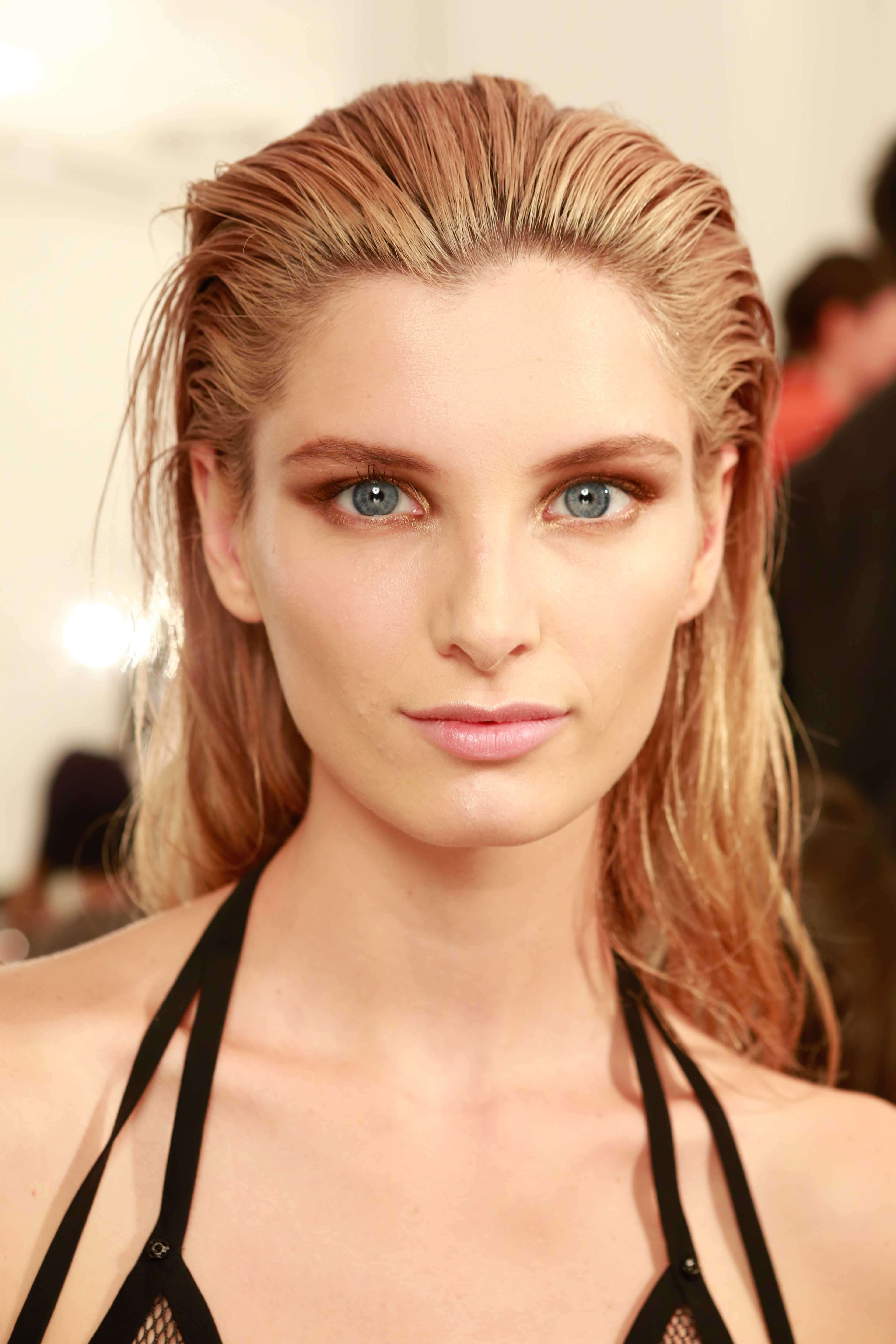 Blonde hair: Front view of a woman with slicked back honey blonde hair